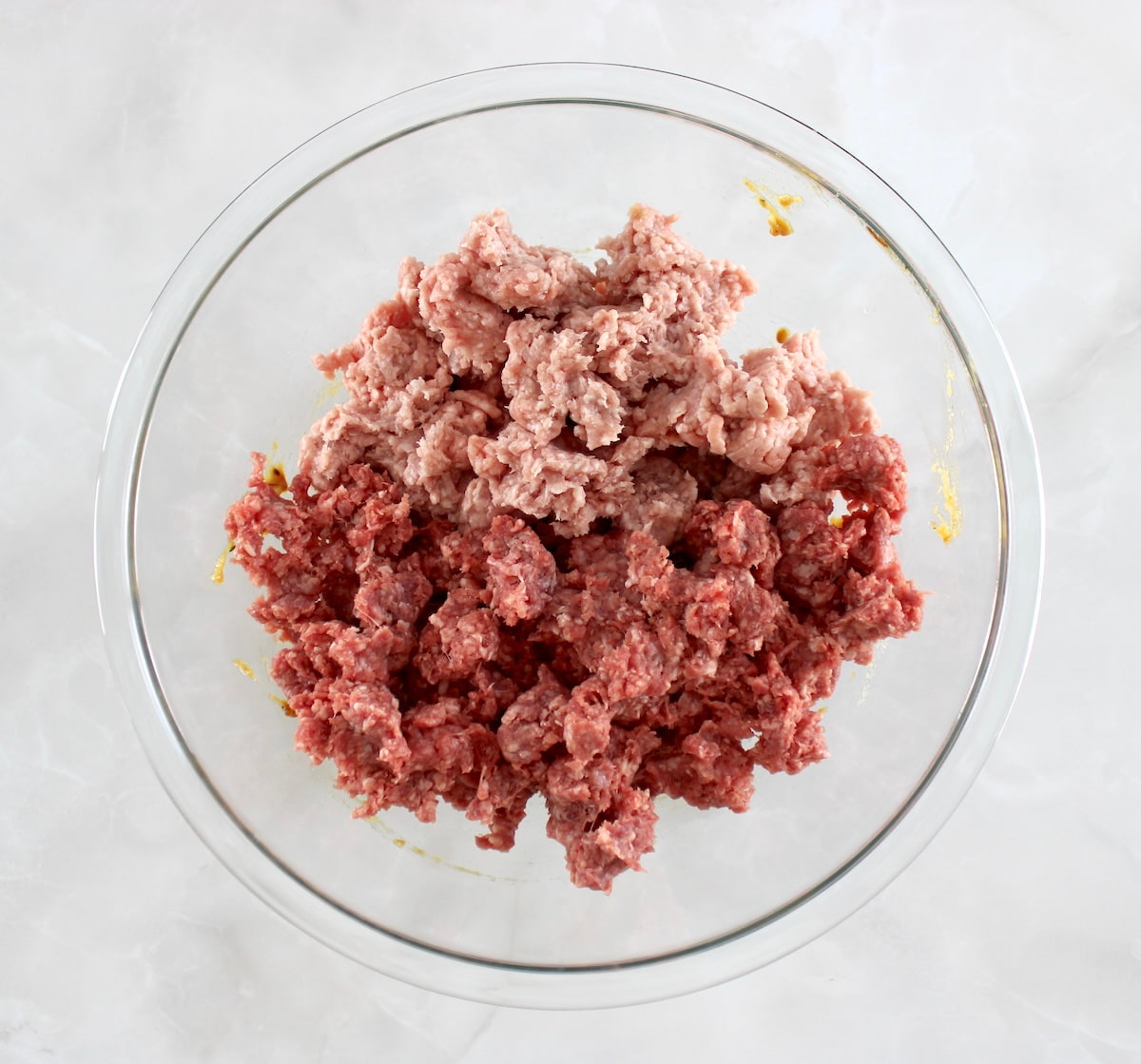 French Onion Meatloaf ingredients in glass bowl unmixed