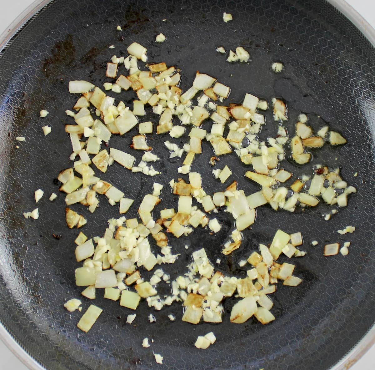 chopped onions and garlic in skillet