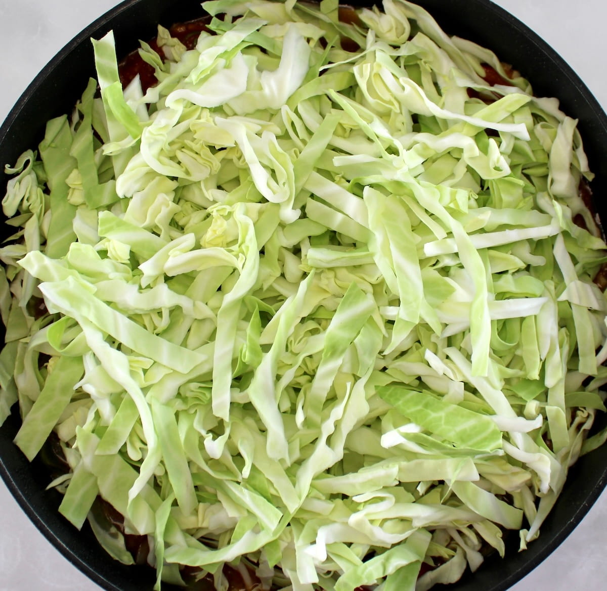 shredded cabbage in skillet