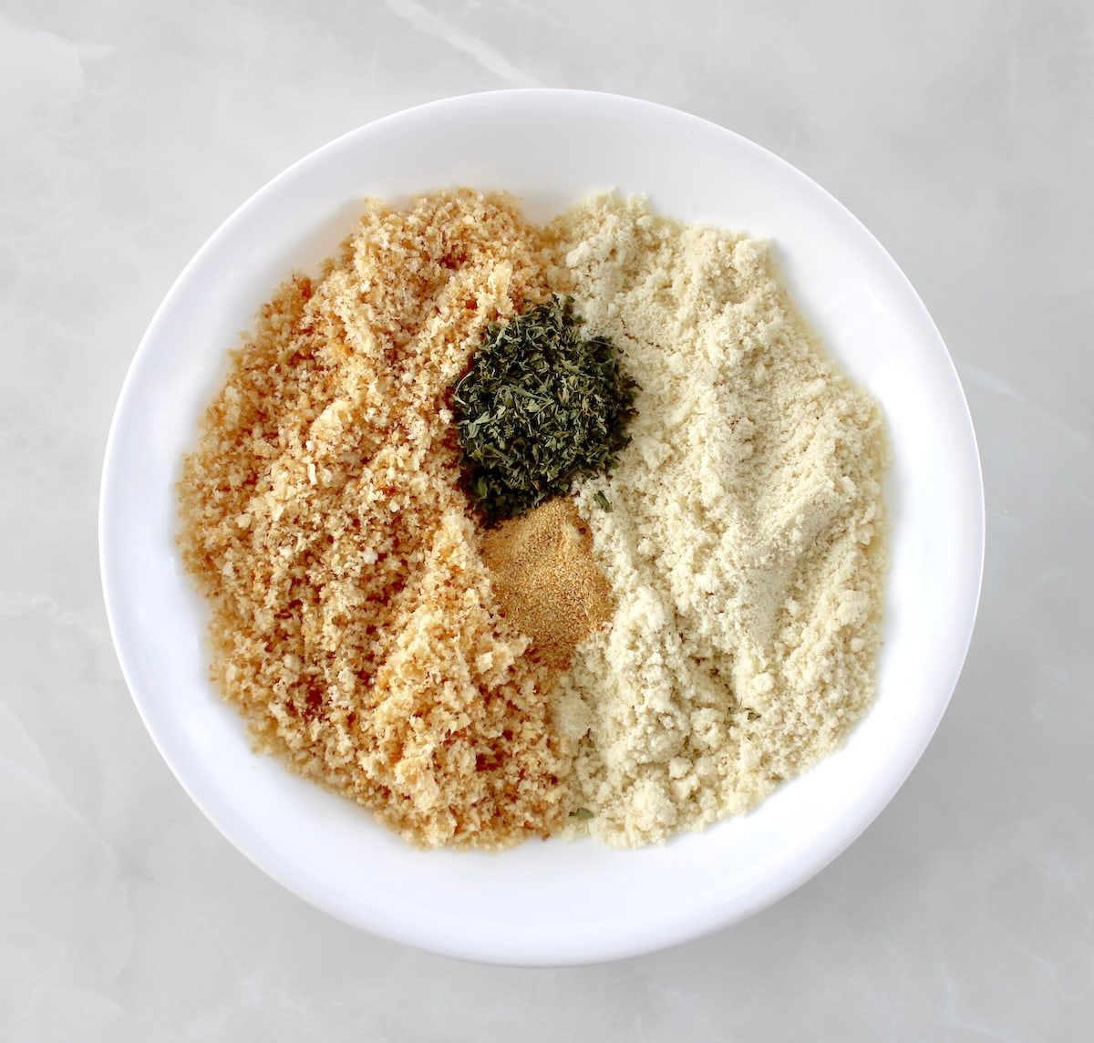 gluten free breading ingredients in white bowl unmixed