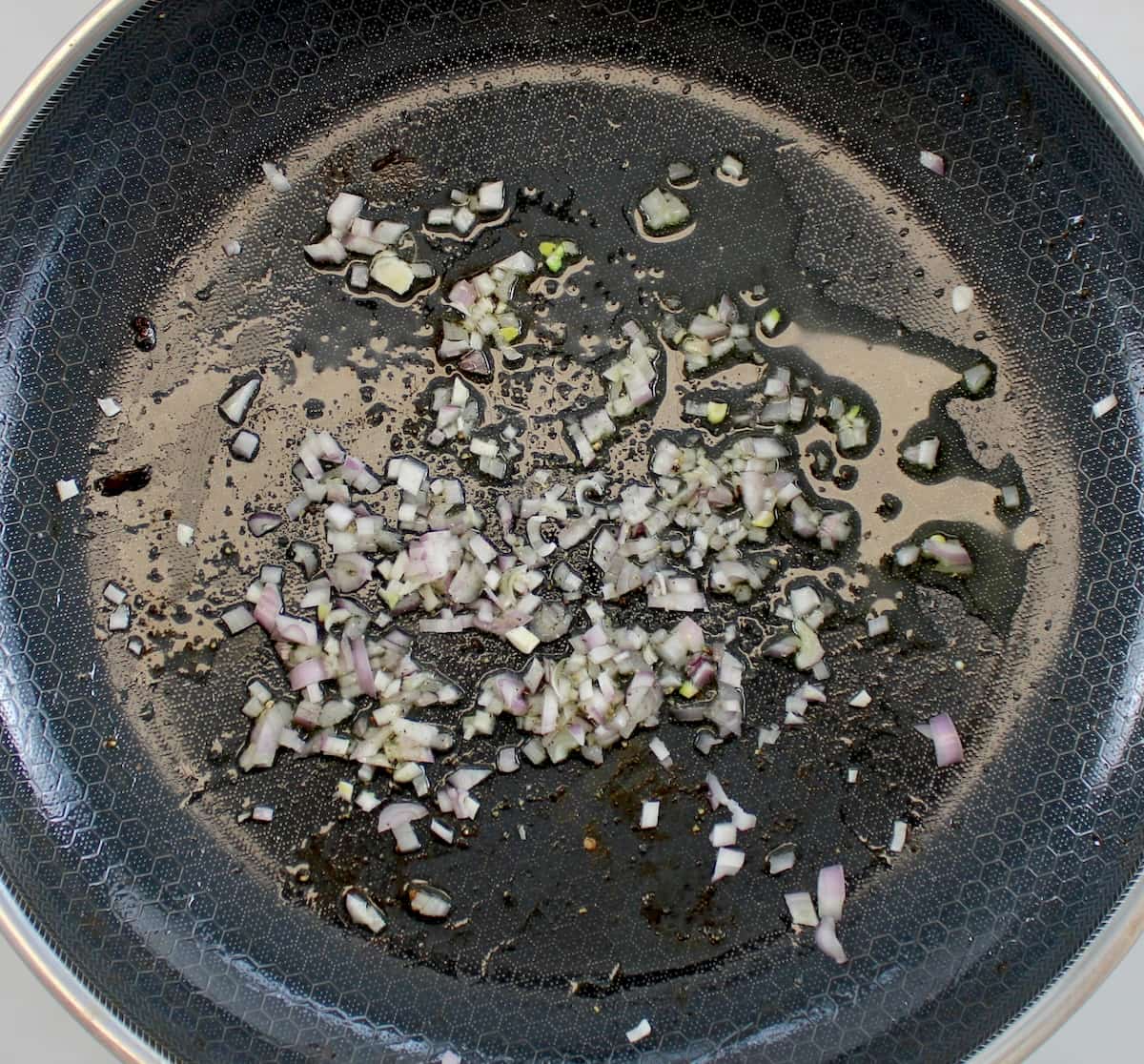 minced shallots in skillet with olive oil