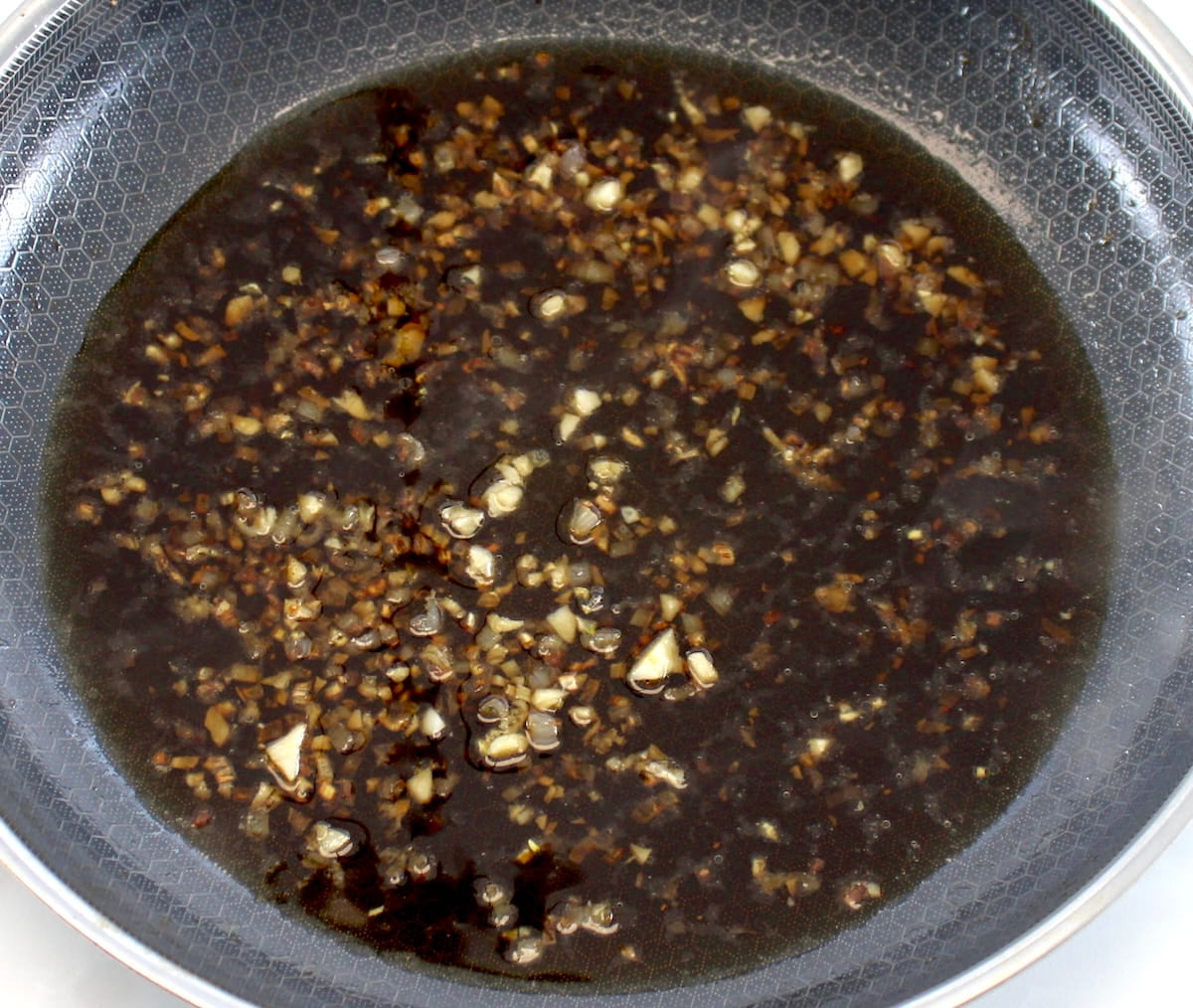 minced shallot, garlic and marsala wine in skillet