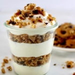 Chocolate Chip Cookie Cheesecake Parfaits in glass jar with cookies in back