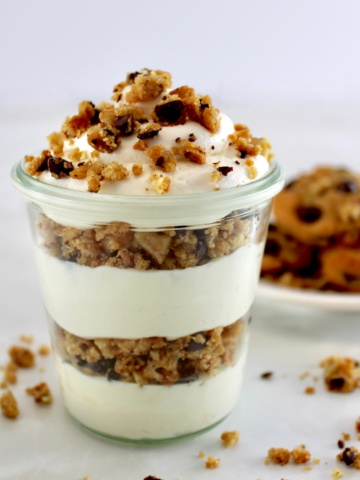 Chocolate Chip Cookie Cheesecake Parfaits in glass jar with cookies in back