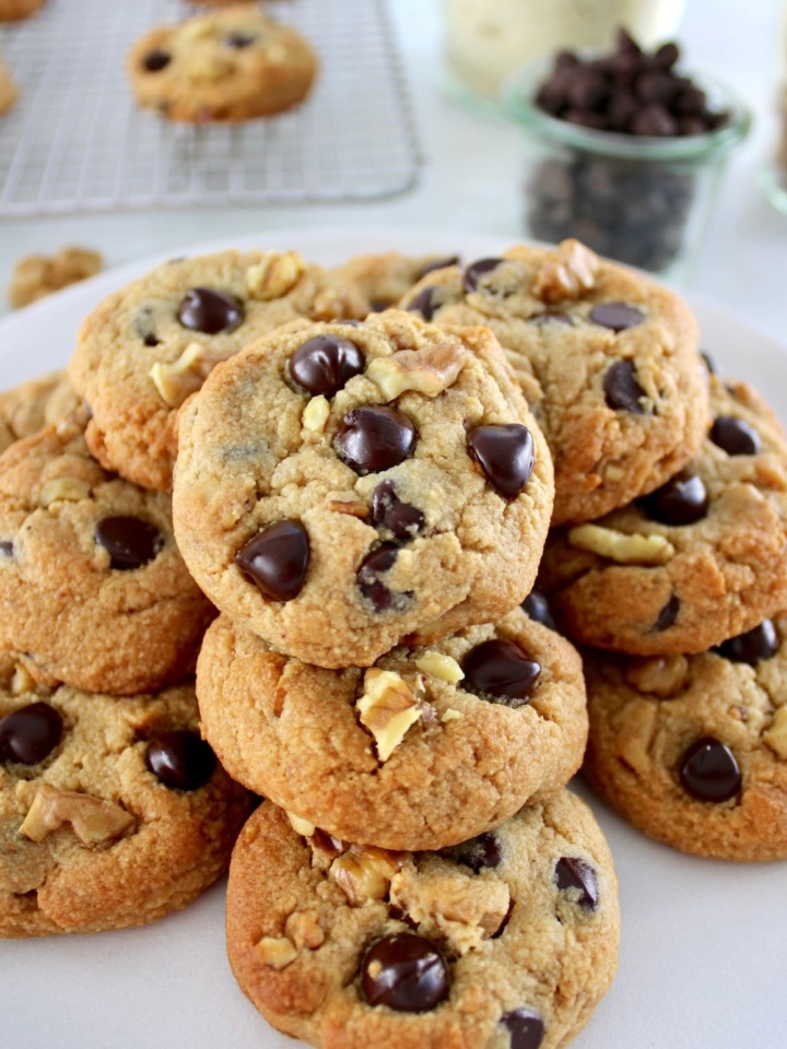 Chocolate Chip Walnut Cookies stacked up on white plate