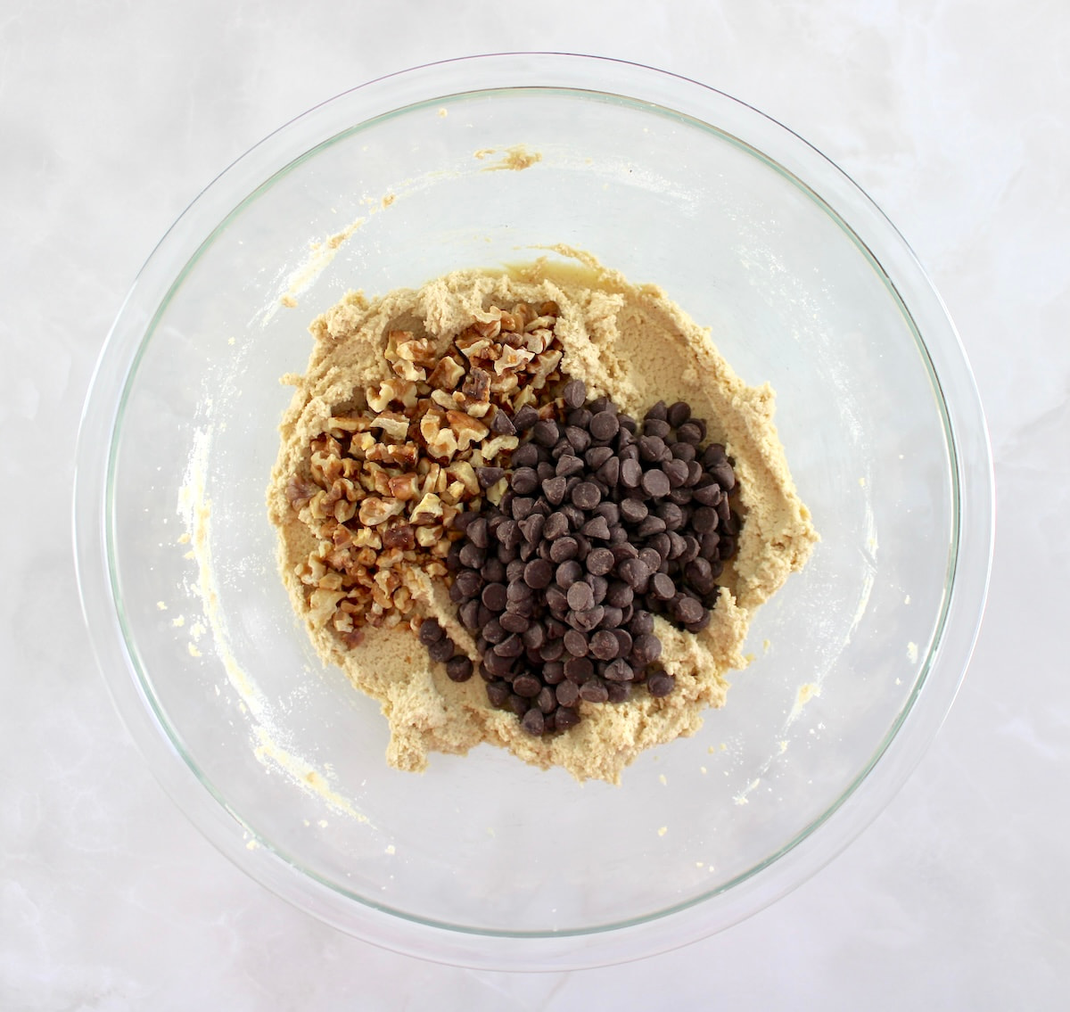 Chocolate Chip Walnut Cookies dough with chocolate chips and walnuts on top