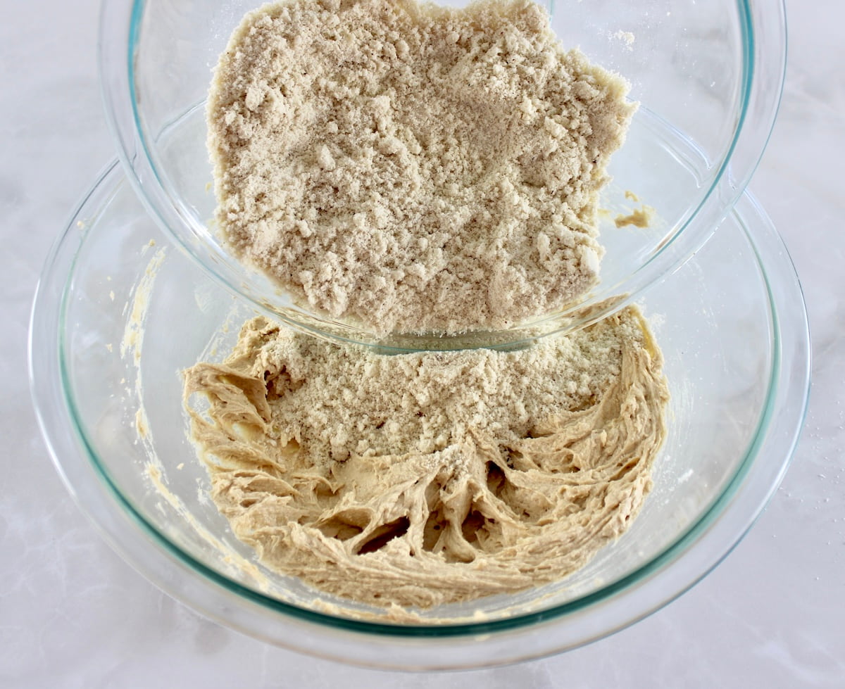 Chocolate Chip Walnut Cookies dry ingredients being poured into the wet
