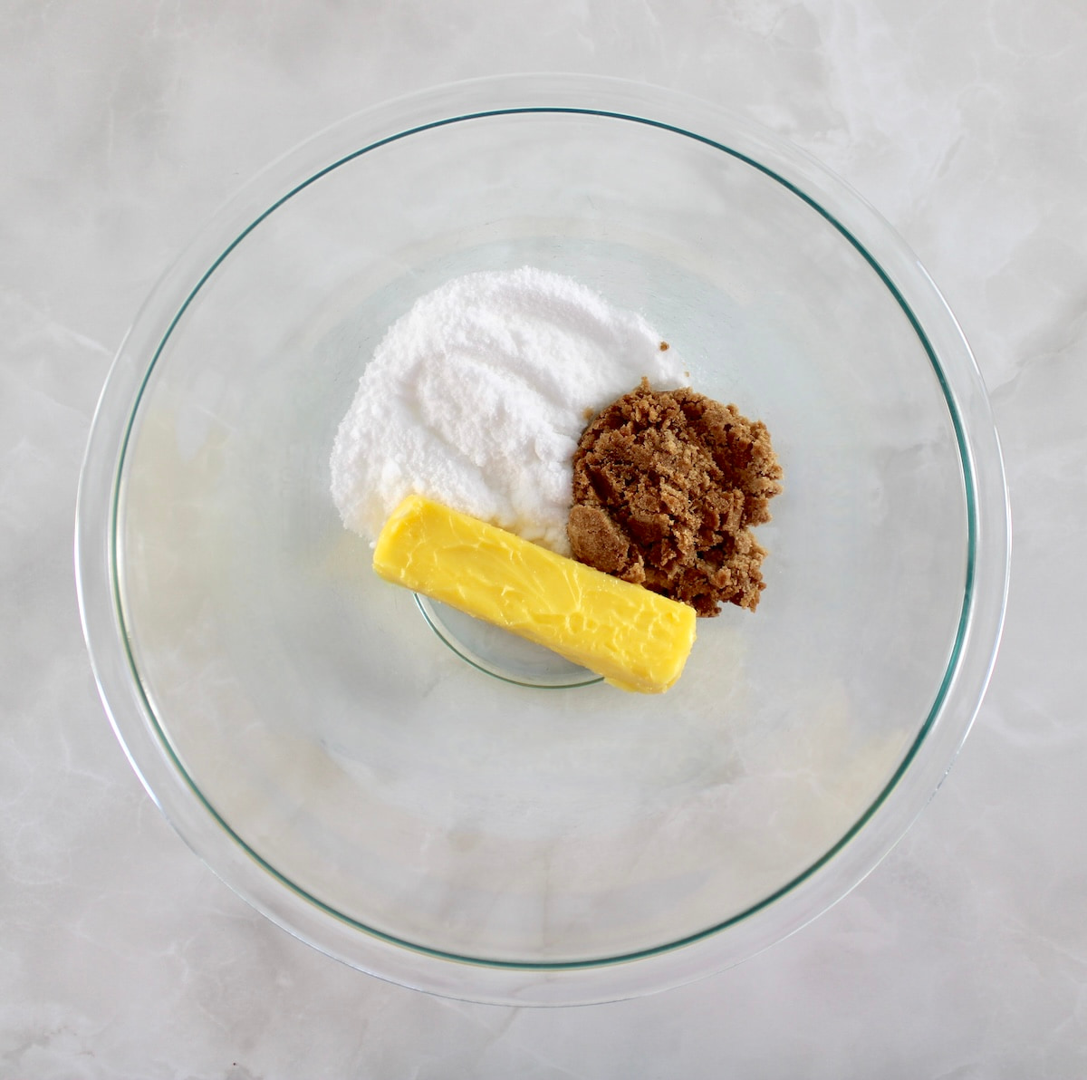 butter and sweetener in glass bowl unmixed