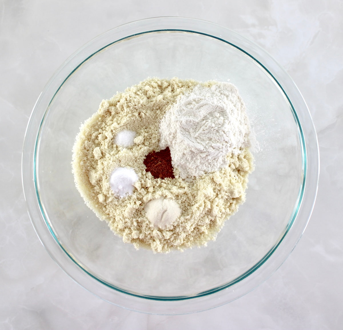 dry ingredients for Chocolate Chip Walnut Cookies in glass bowl unmixed