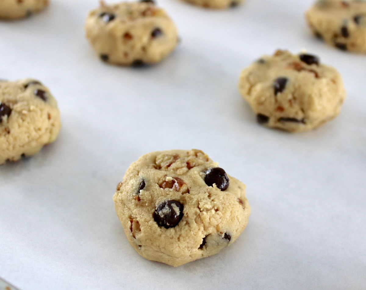 Chocolate Chip Walnut Cookies in balls on parchment paper