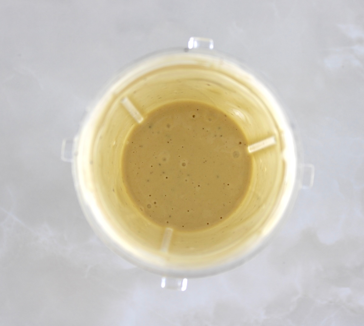 Lemon Tahini Dressing in bullet blender cup