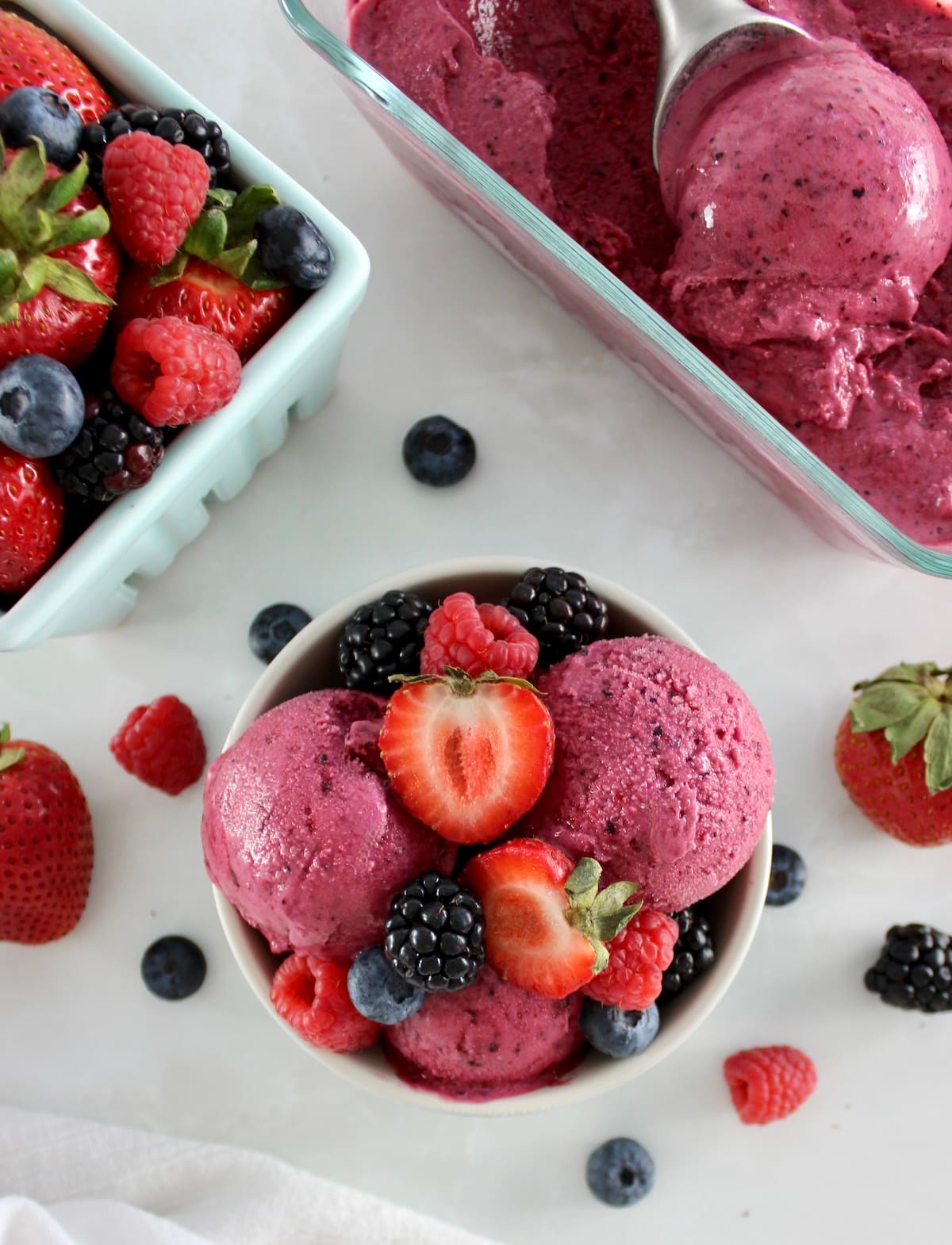 overhead closeup of Mixed Berry Frozen Yogurt in bowl with fresh berries on top