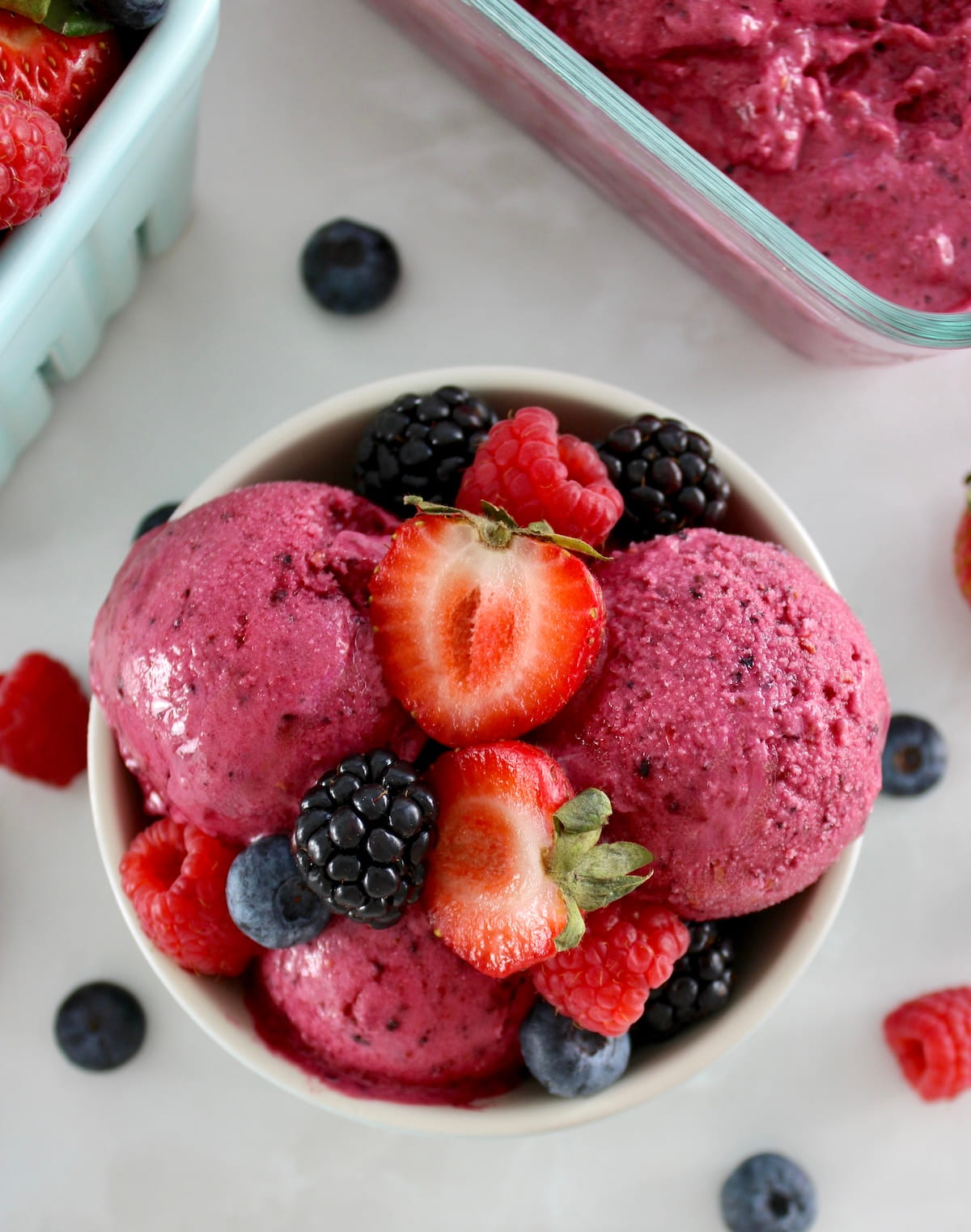 overhead closeup of Mixed Berry Frozen Yogurt in bowl with fresh berries on top