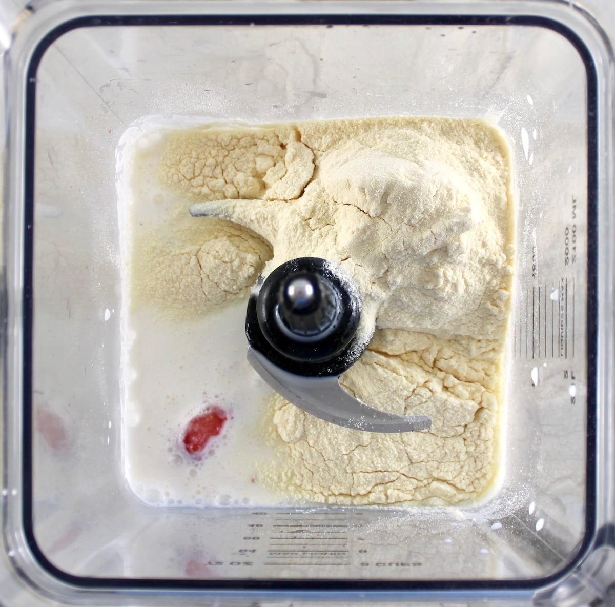 Strawberry Protein Shake ingredients in blender unmixed
