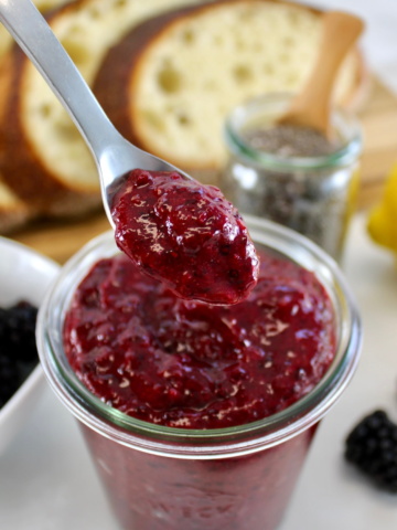 spooning Blackberry Chia Seed Jam out of open jar