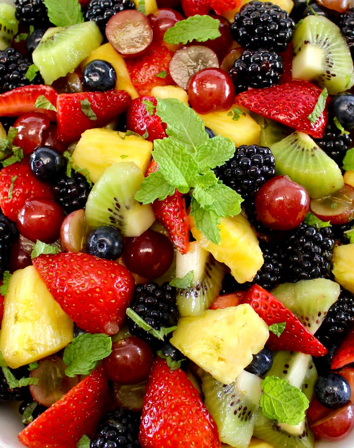 closeup of Easy Fruit Salad with fresh mint sprig