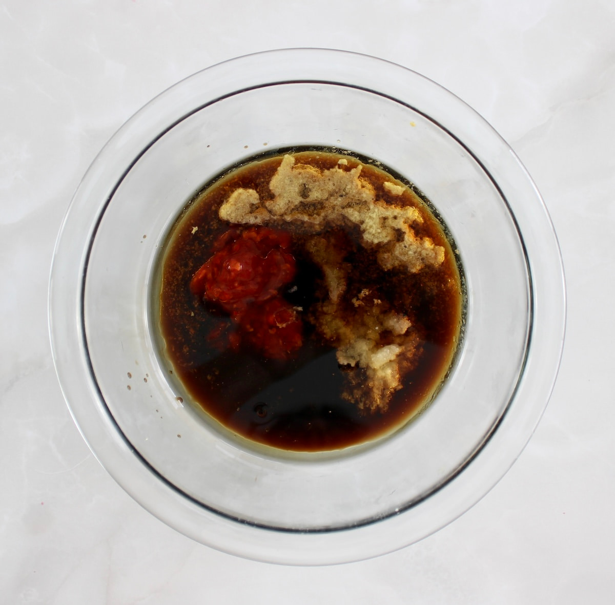 Grilled Asian Chicken marinade ingredients in glass bowl unmixed