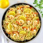 Shrimp Scampi with Linguine in skillet with lemon slices and chopped parsley