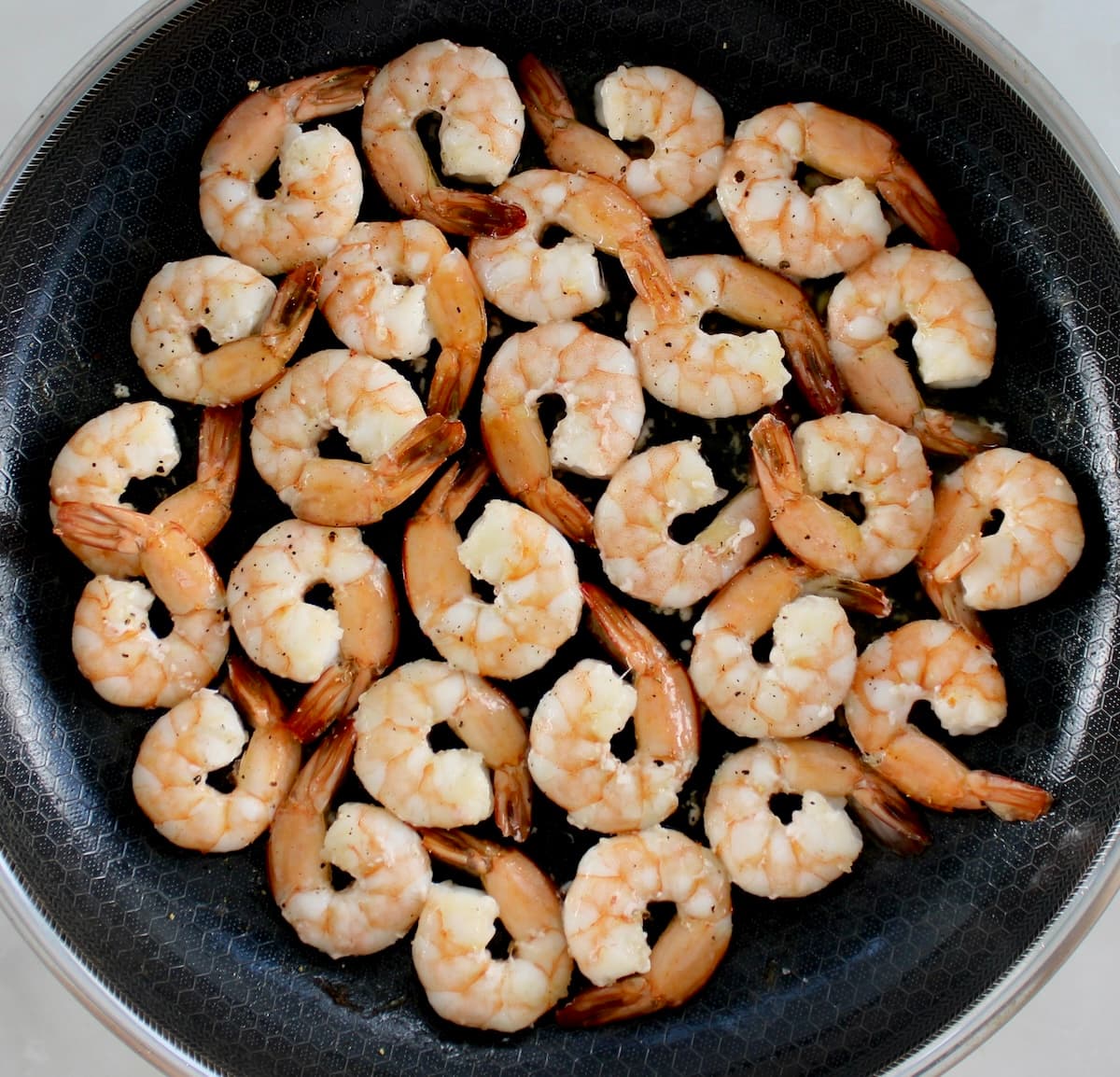 shrimp cooking in skillet
