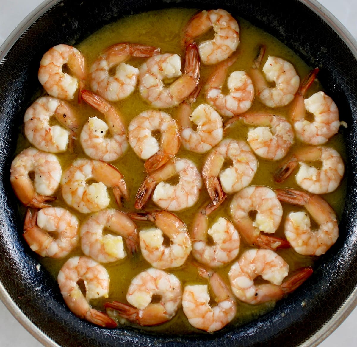 Shrimp Scampi with sauce in skillet