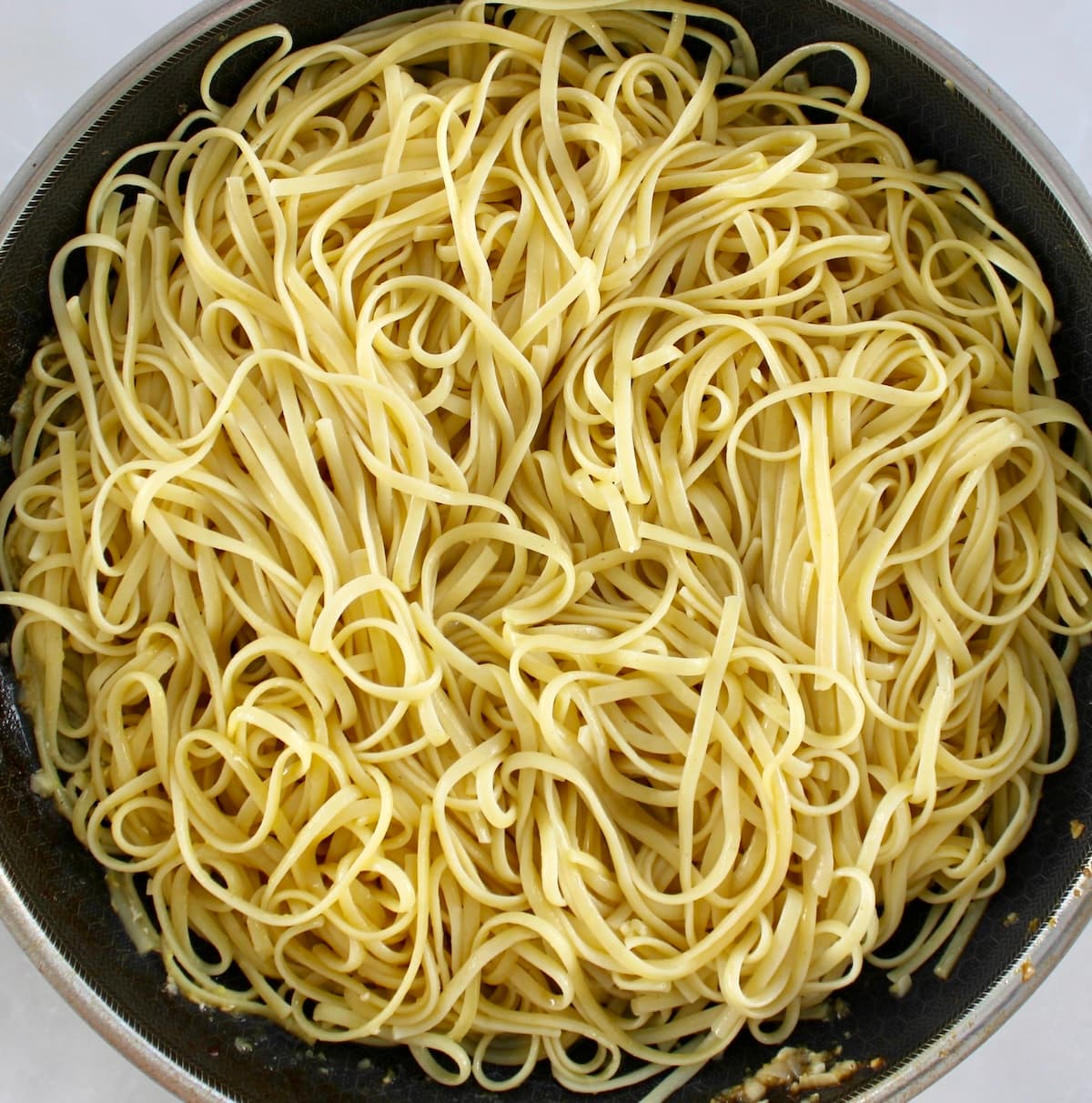 cooked spaghetti in skillet