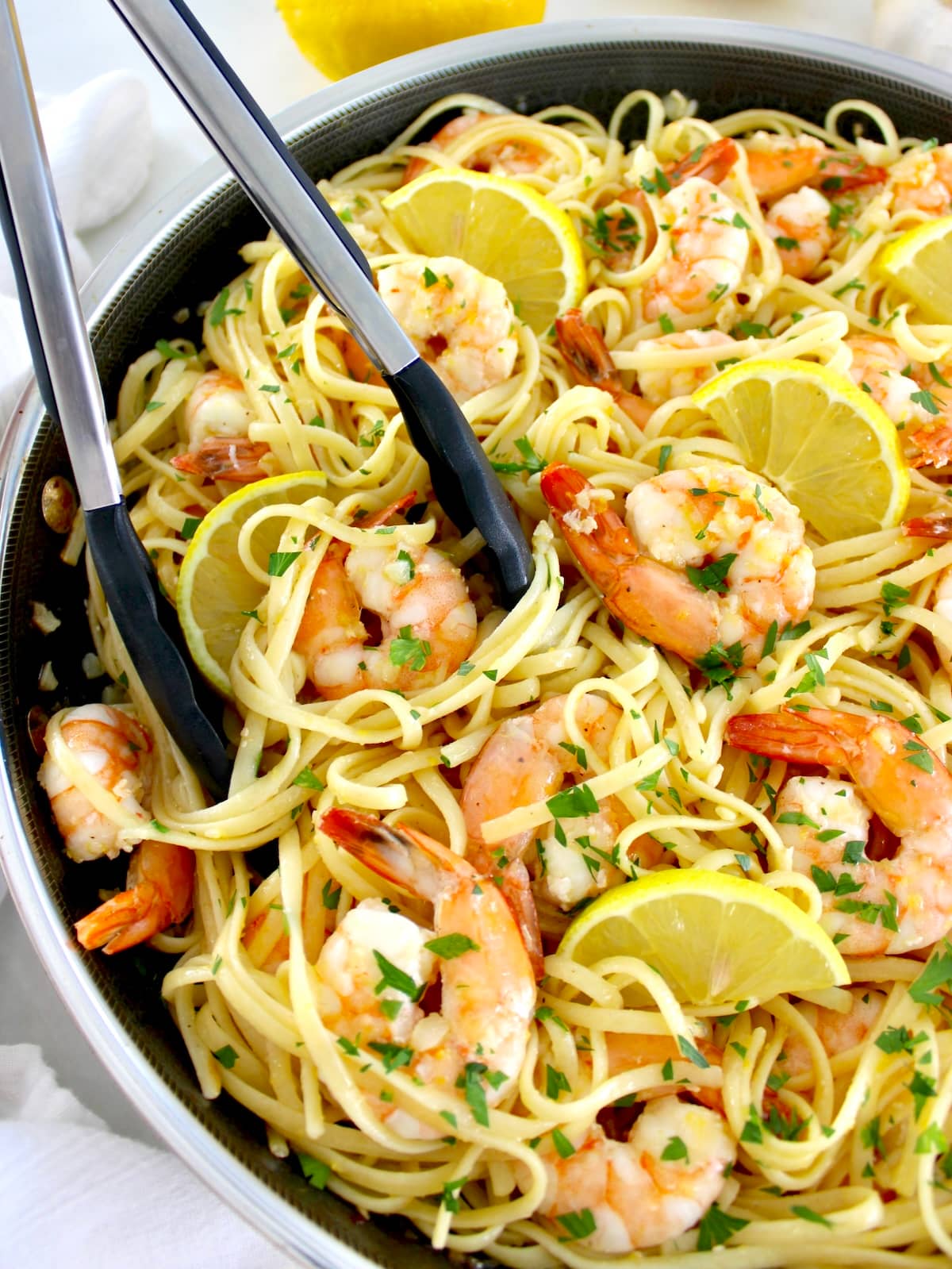 Shrimp Scampi with Linguine with tongs on side