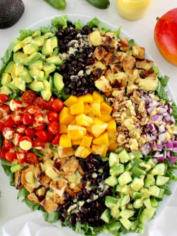 Chopped Chicken Mango Salad with ingredients in groups on white platter