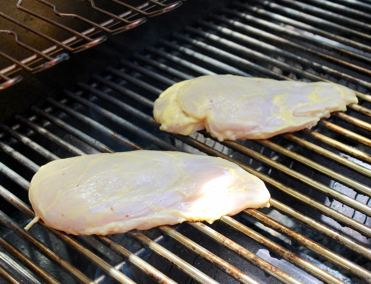 2 pieces of marinated chicken breast on grill