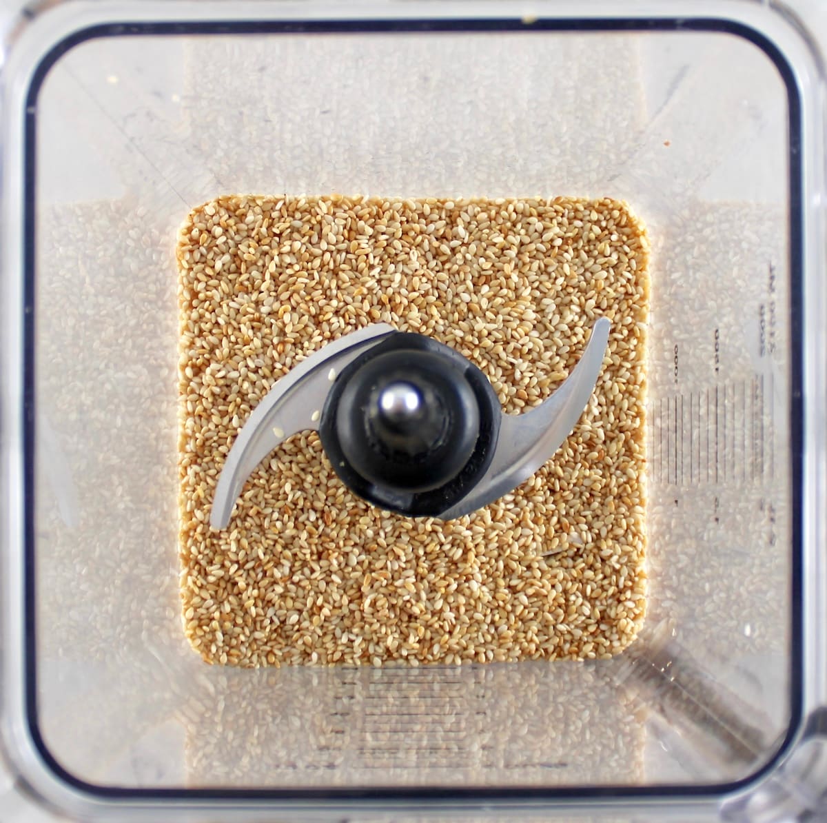 overhead view of toasted sesame seeds in blender
