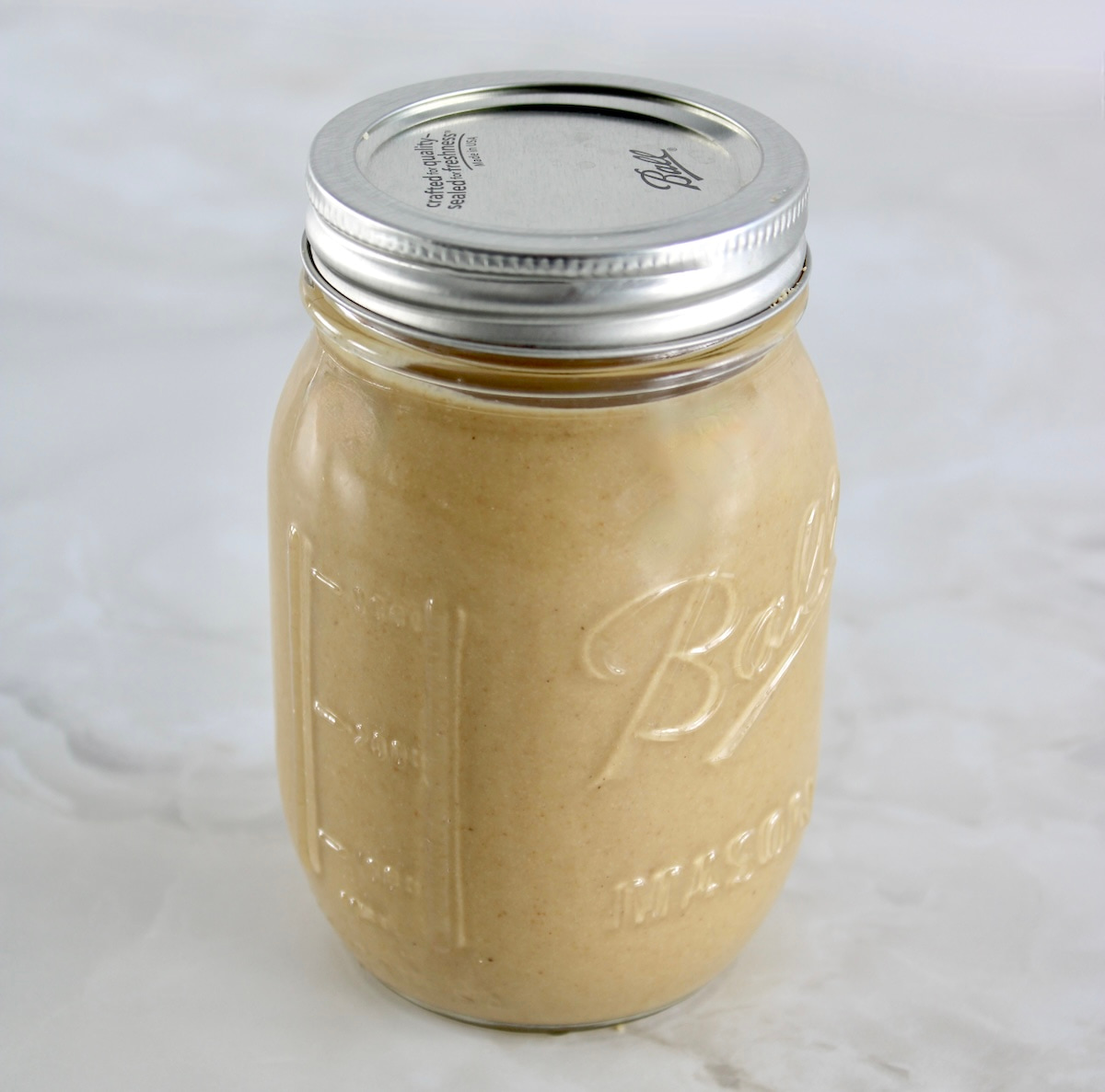 Homemade Tahini in ball pint jar with lid