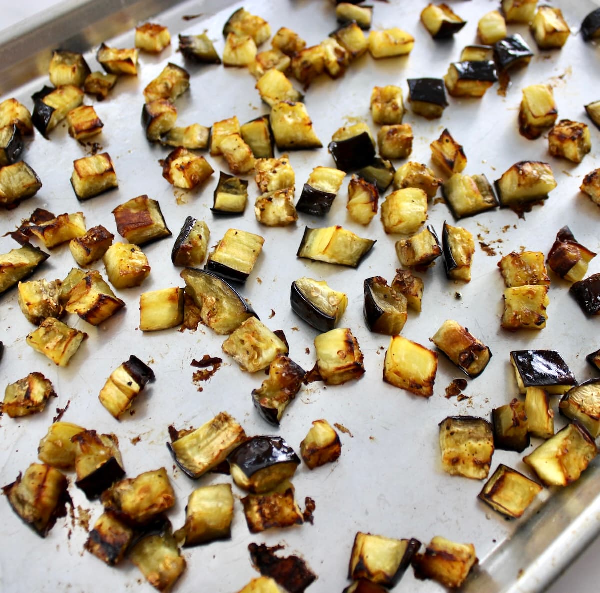 cubed roasted Eggplant on sheet pan
