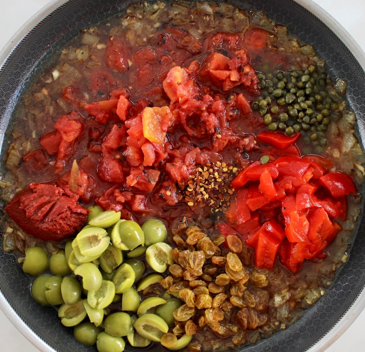 Eggplant Caponata ingredients in skillet unmixed