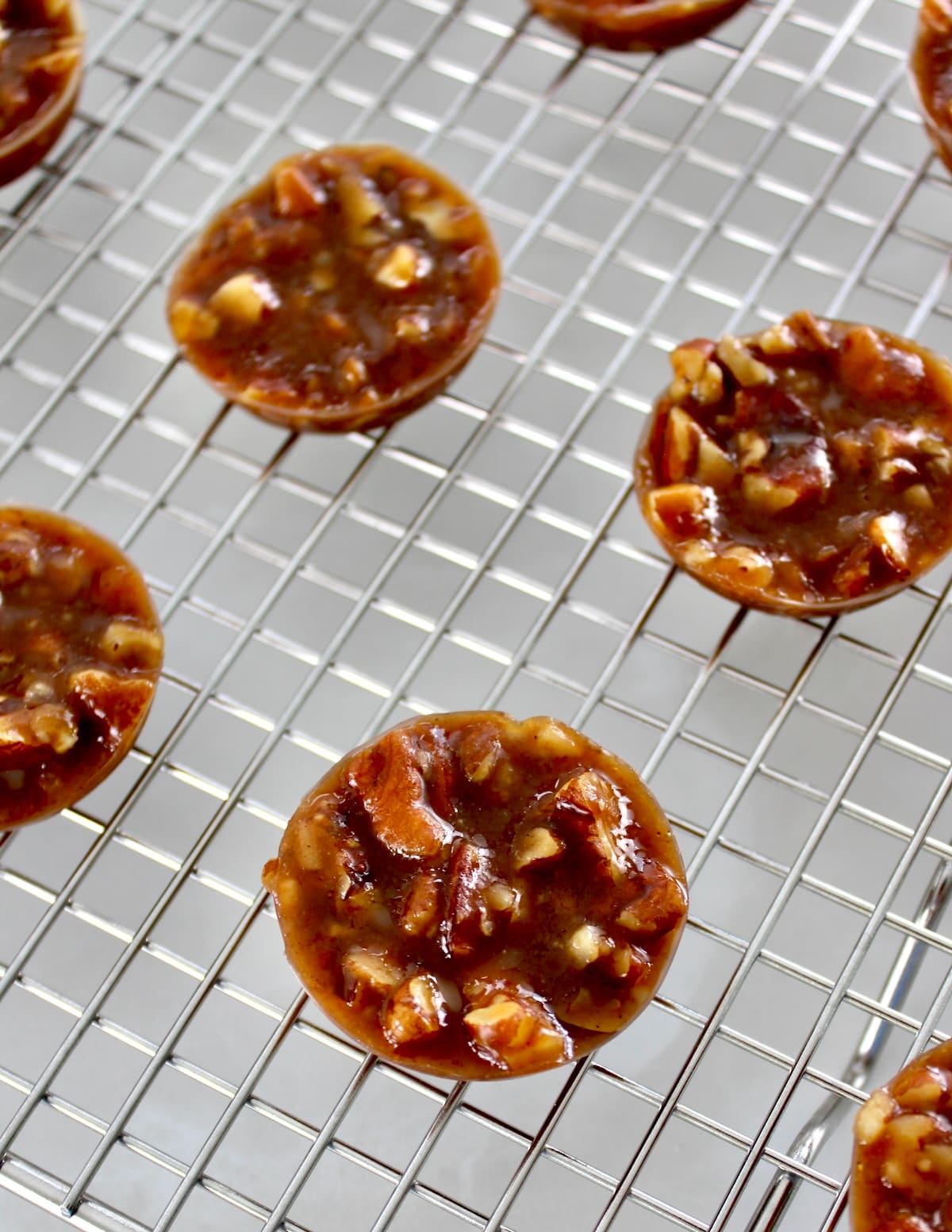 overhead view of Pecan Caramel Clusters on wire rack