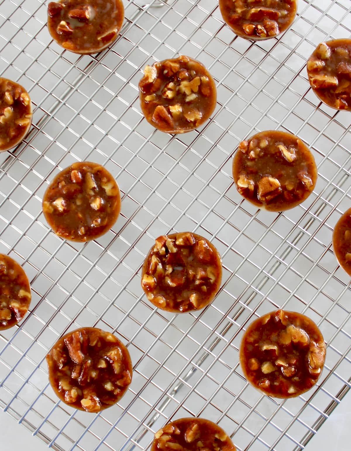 overhead view of Pecan Caramel Clusters on wire rack
