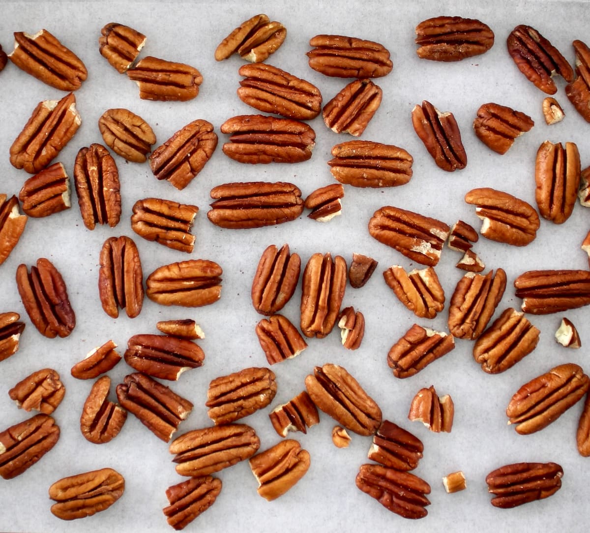 pecan halves on parchment paper