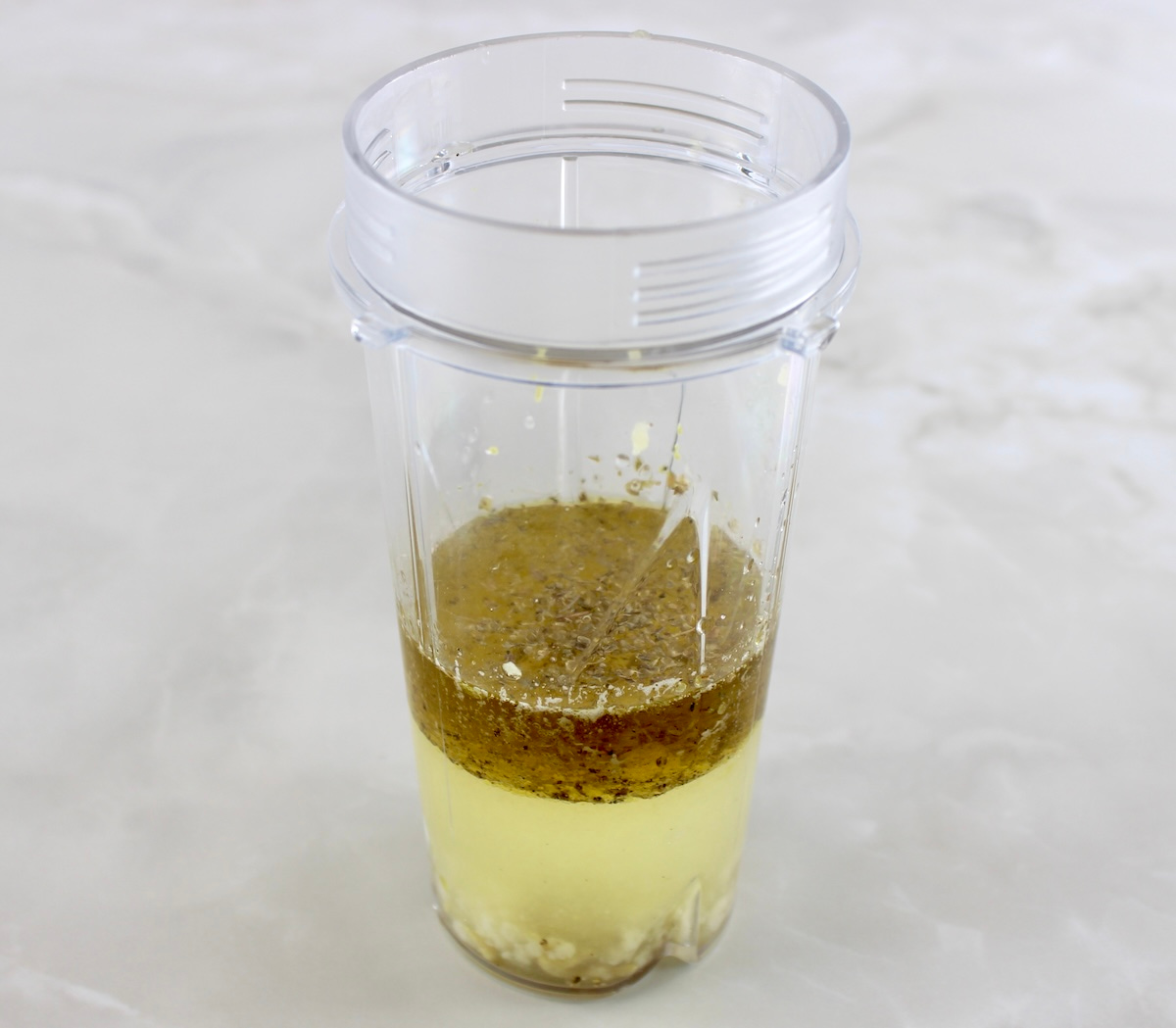 Chickpea Tuna Pasta Salad dressing ingredients in bullet blended cup unmixed