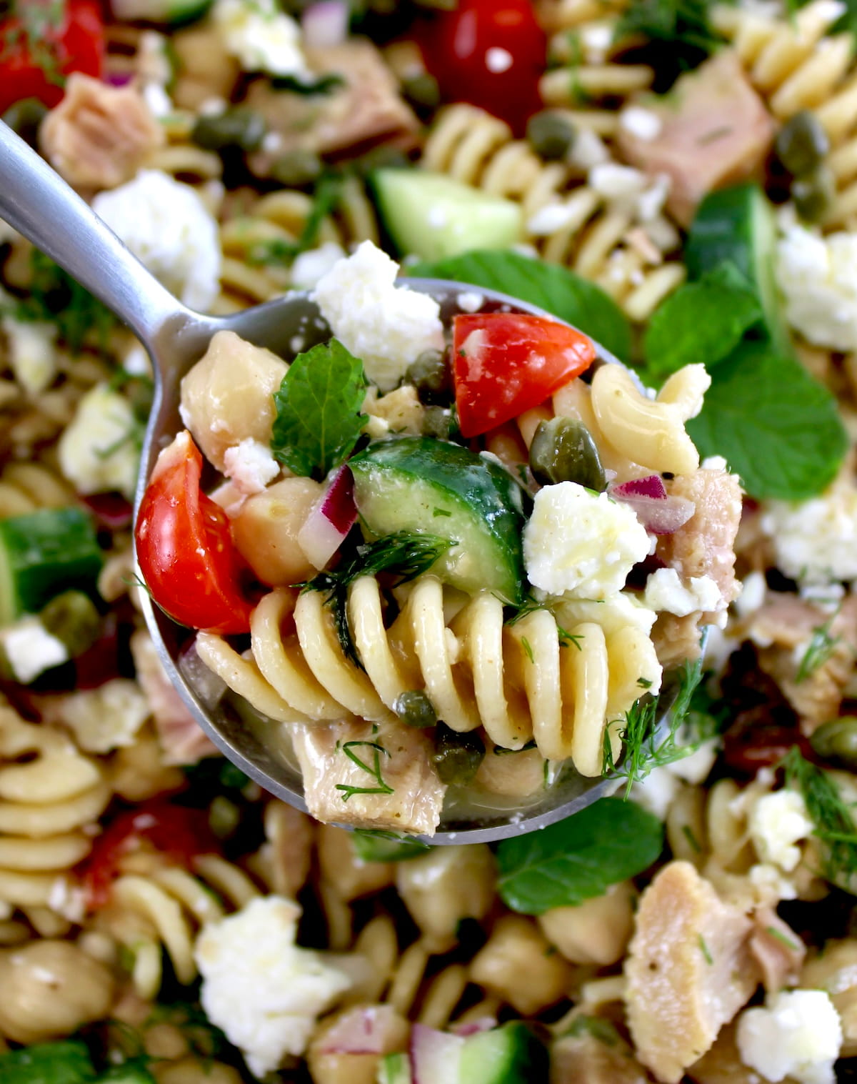 holding up spoonful of Chickpea Tuna Pasta Salad