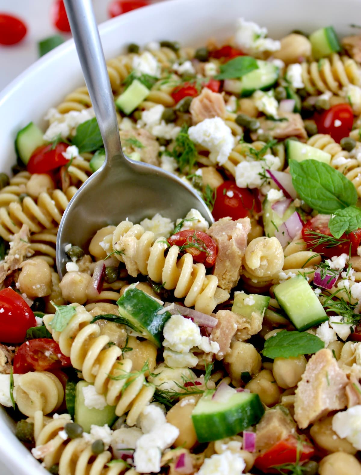 Chickpea Tuna Pasta Salad in white bowl with spoon