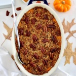 overhead view of Pumpkin Casserole in oval dish with serving spoon on side
