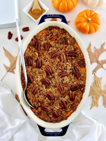 overhead view of Pumpkin Casserole in oval dish with serving spoon on side