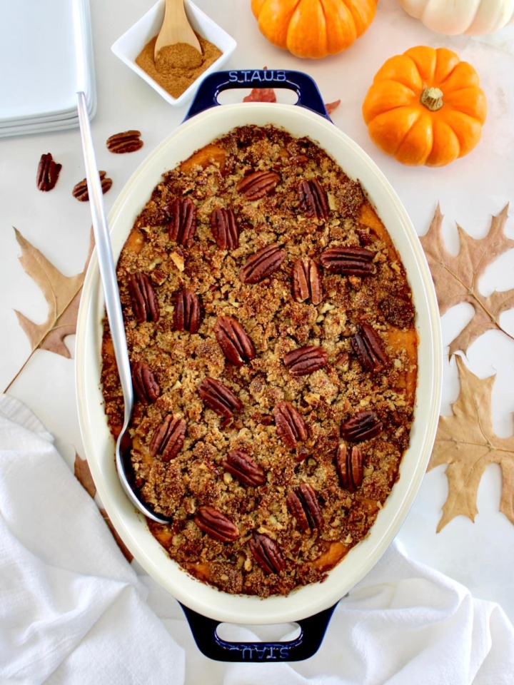 overhead view of Pumpkin Casserole in oval dish with serving spoon on side