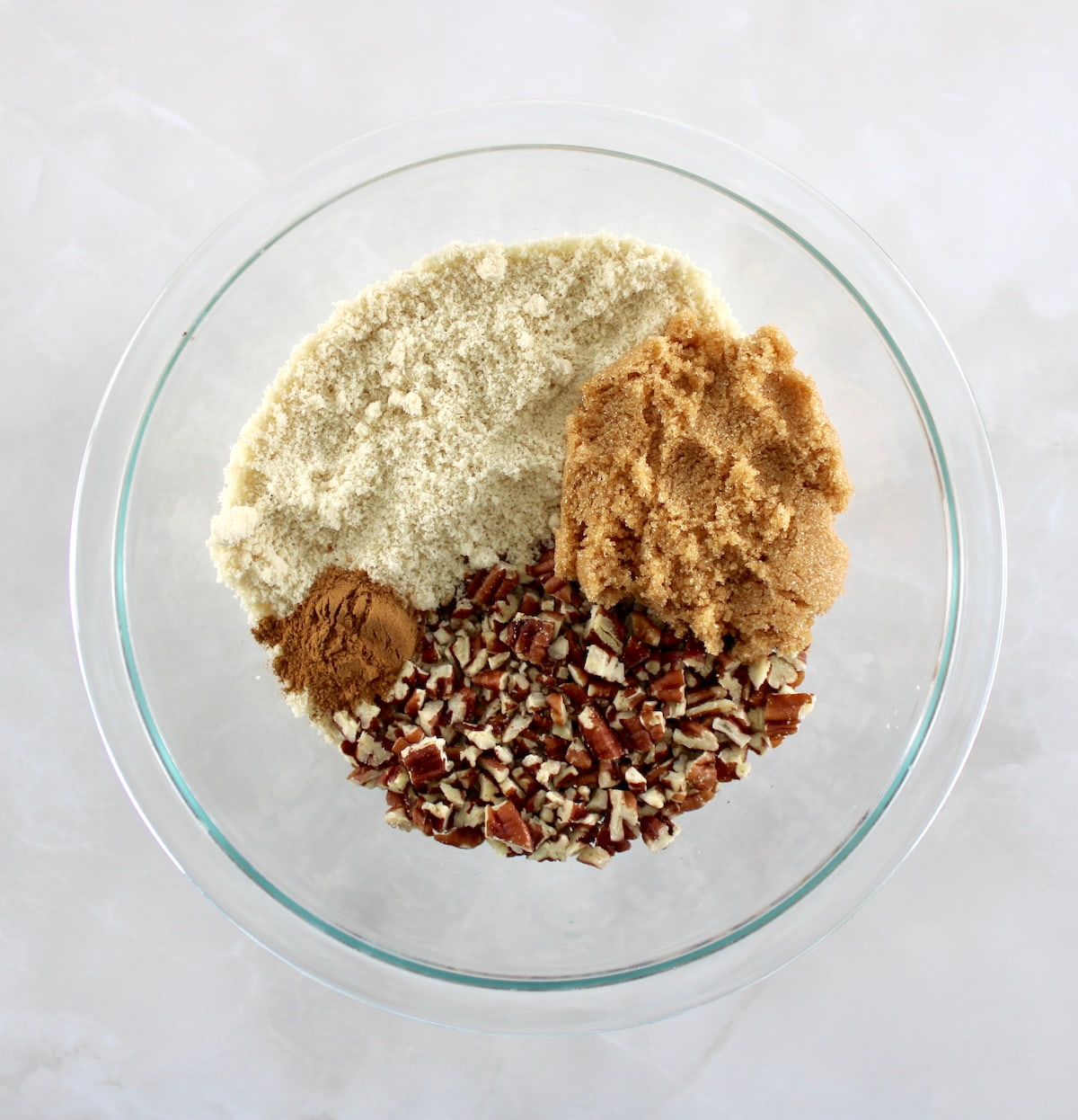 Pumpkin Casserole streusel topping ingredients in glass bowl unmixed