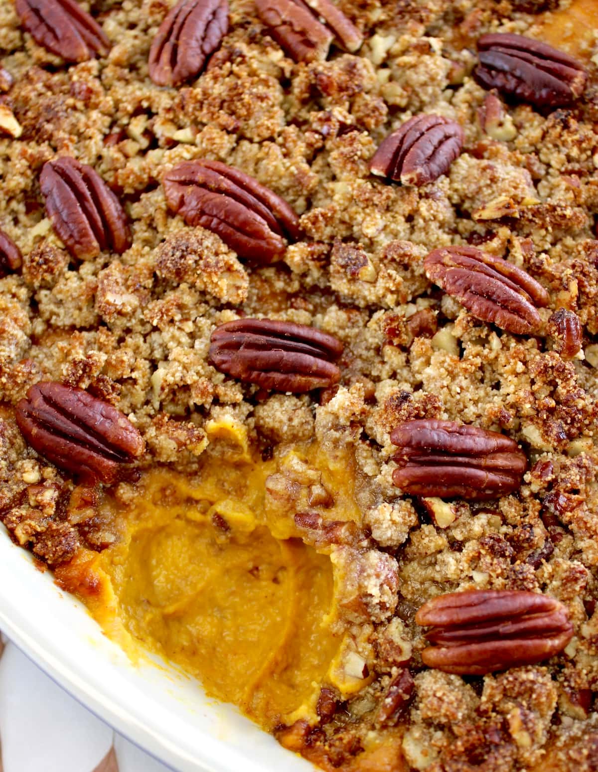 closeup of Pumpkin Casserole with piece missing to reveal pumpkin